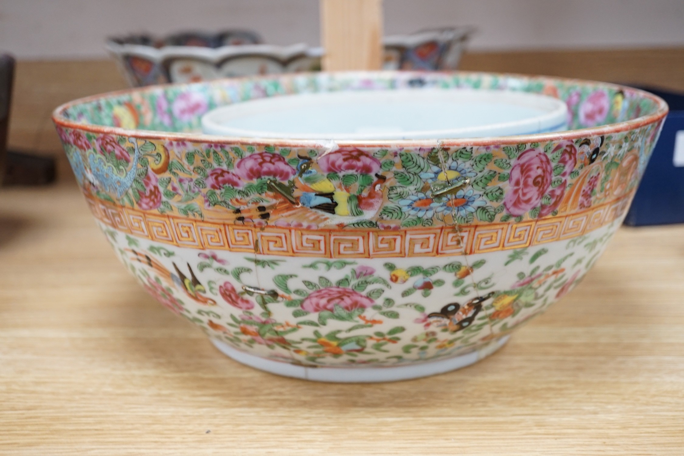 A 19th century Imari bowl, a famille rose bowl and one other- all damaged